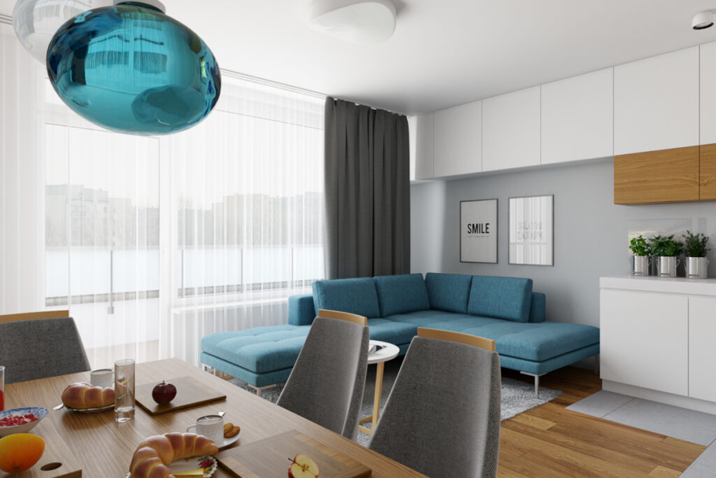 Jasny salon z niebieską sofą Warszawa